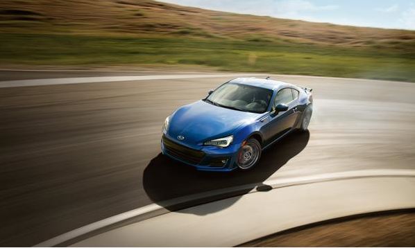 A blue 2020 Subaru BRZ drifts on a track. The BRZ posted the highest percentage increase in Subaru of America sales for September 2020. 